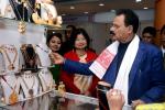  Industries and Commerce Minister Chandra Mohan Patowary visiting the stalls and admiring the products of the Assamese jewellery